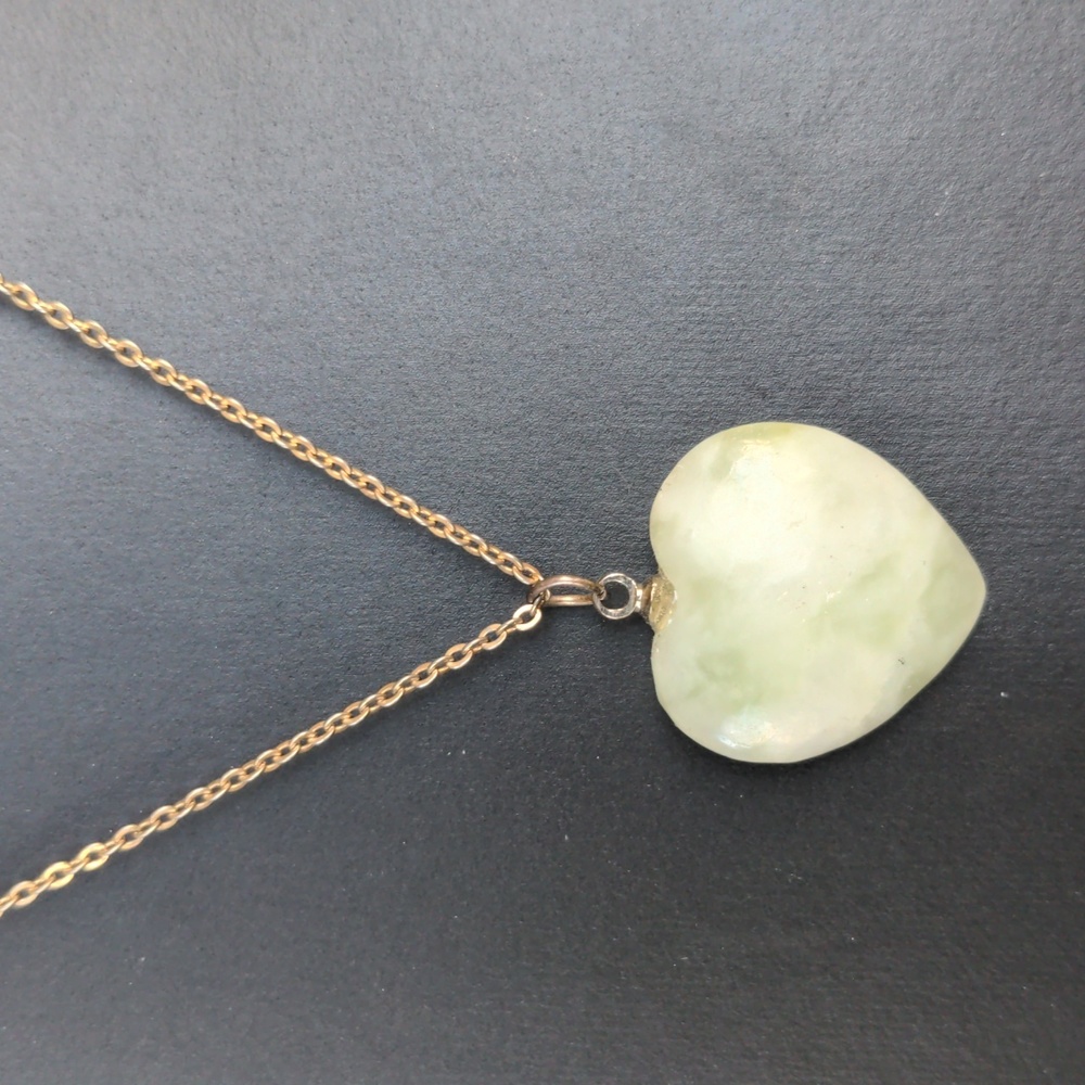 Vintage silver tone necklace with natural carved heart stone pendant